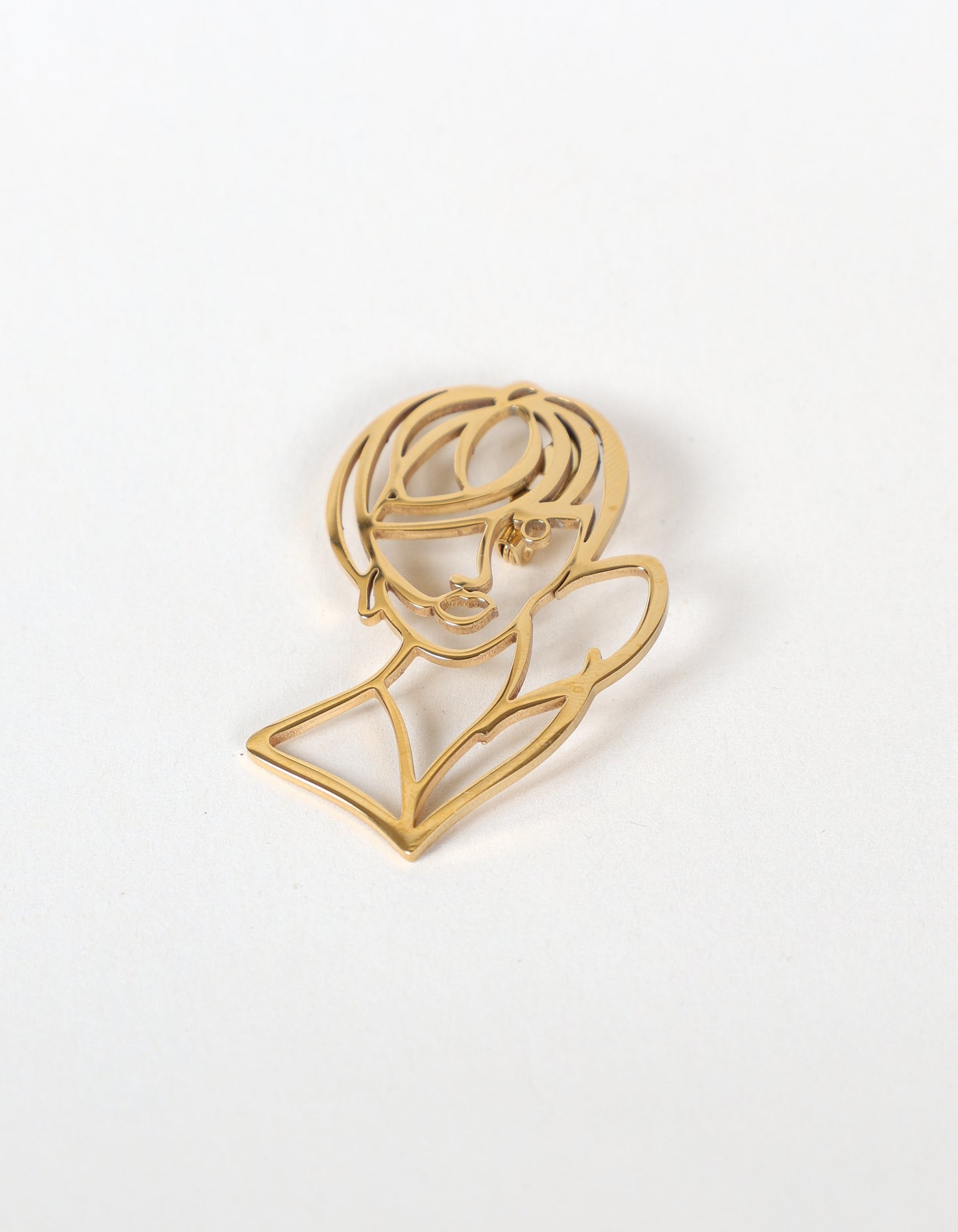 Broche visage abstrait en doré